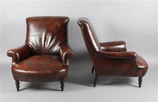 A pair of French leather club armchairs